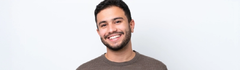 Young man smiling, representing male fertility support services at Dr Kate Burston Newcastle clinic