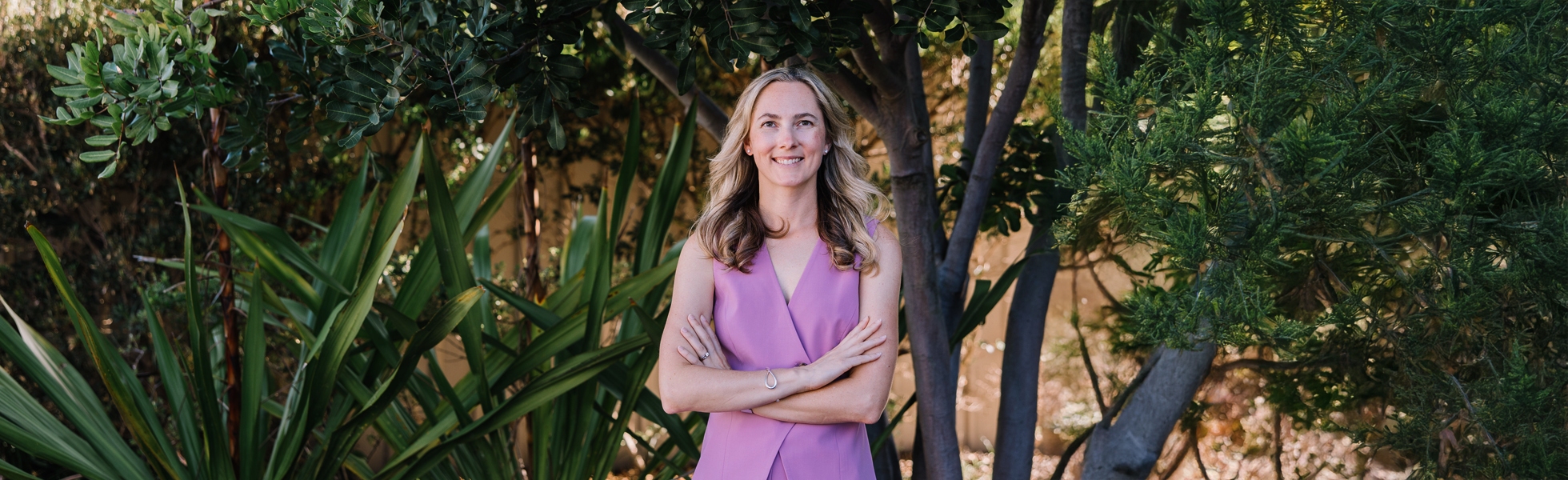 Dr Kate Burston, fertility specialist in Newcastle, standing outdoors at her clinic