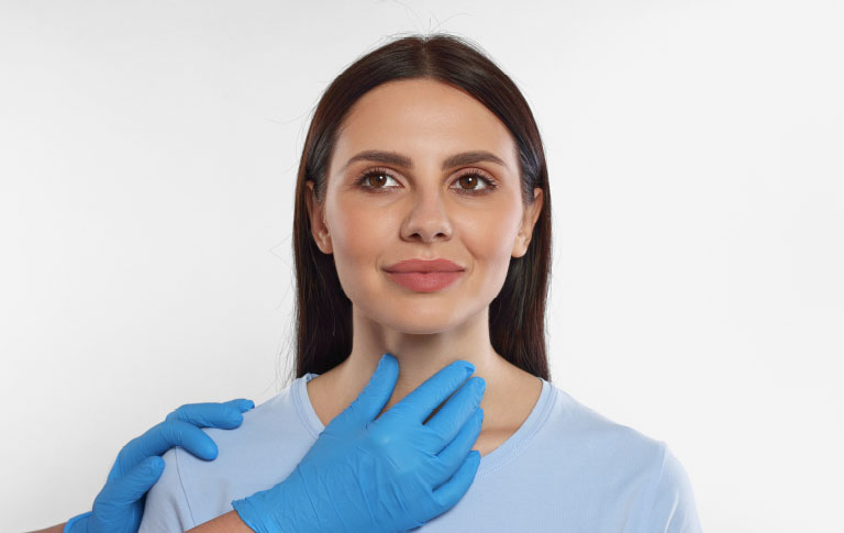 Doctor examining thyroid gland for reproductive endocrinology, Newcastle